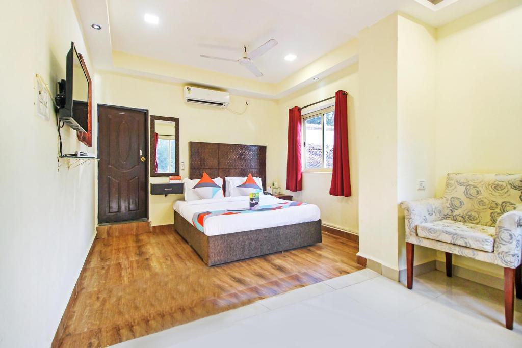Postel nebo postele na pokoji v ubytování FabHotel Golden Nest Deluxe - Nr Calangute Beach