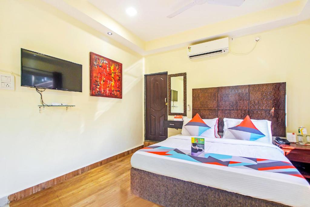 Postel nebo postele na pokoji v ubytování FabHotel Golden Nest Deluxe - Nr Calangute Beach
