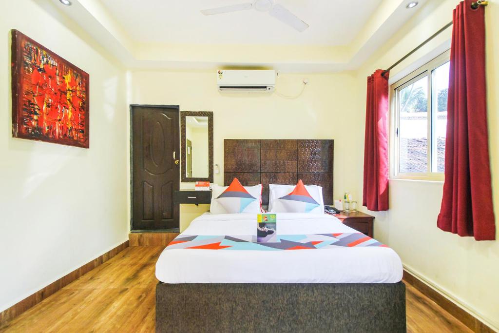 Postel nebo postele na pokoji v ubytování FabHotel Golden Nest Deluxe - Nr Calangute Beach