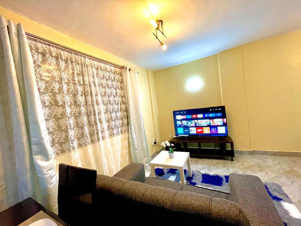 TV a/nebo společenská místnost v ubytování Countryside Apartment