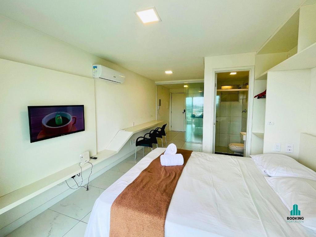 a hospital room with a bed with a pink hat on it at Fortaleza Sul Flats Service in Fortaleza