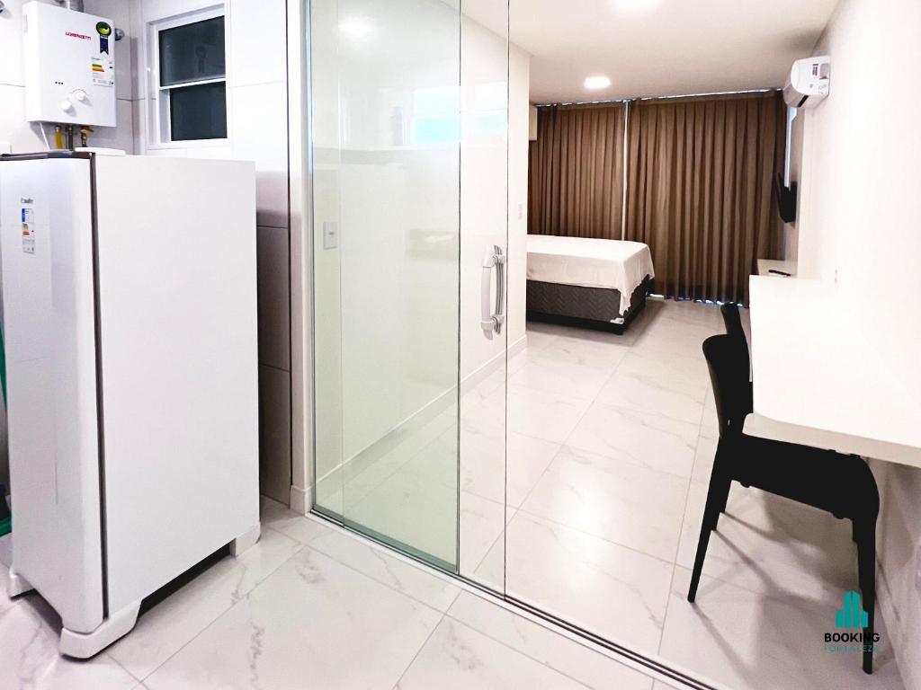 a bathroom with a glass shower in a room at Fortaleza Sul Flats Service in Fortaleza