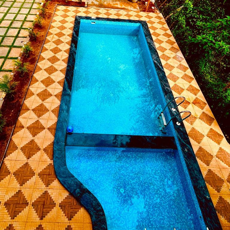 Bazén v ubytování Nature View Resort Yercaud nebo v jeho okolí