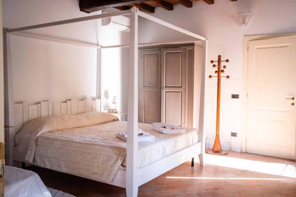 Postel nebo postele na pokoji v ubytování Agriturismo Corte Capiluppia