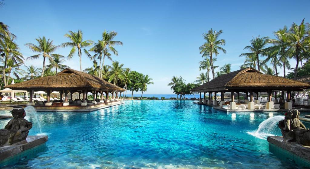 a pool at the excellence punta cana resort at InterContinental Bali Resort by IHG in Jimbaran