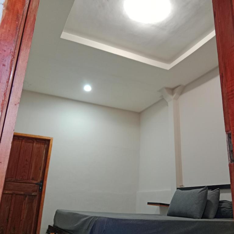 Postel nebo postele na pokoji v ubytování Iza home stay