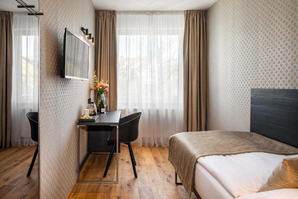 Postel nebo postele na pokoji v ubytování Hotel Aida