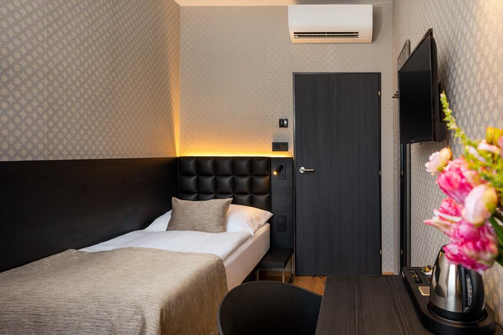 Postel nebo postele na pokoji v ubytování Hotel Aida