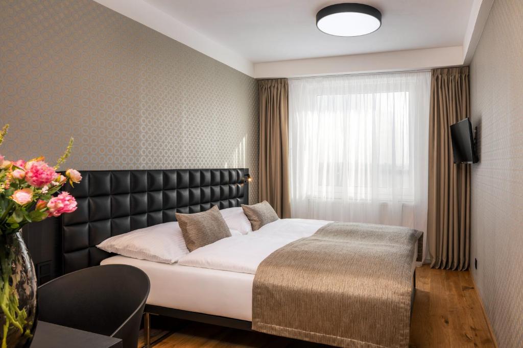Postel nebo postele na pokoji v ubytování Hotel Aida