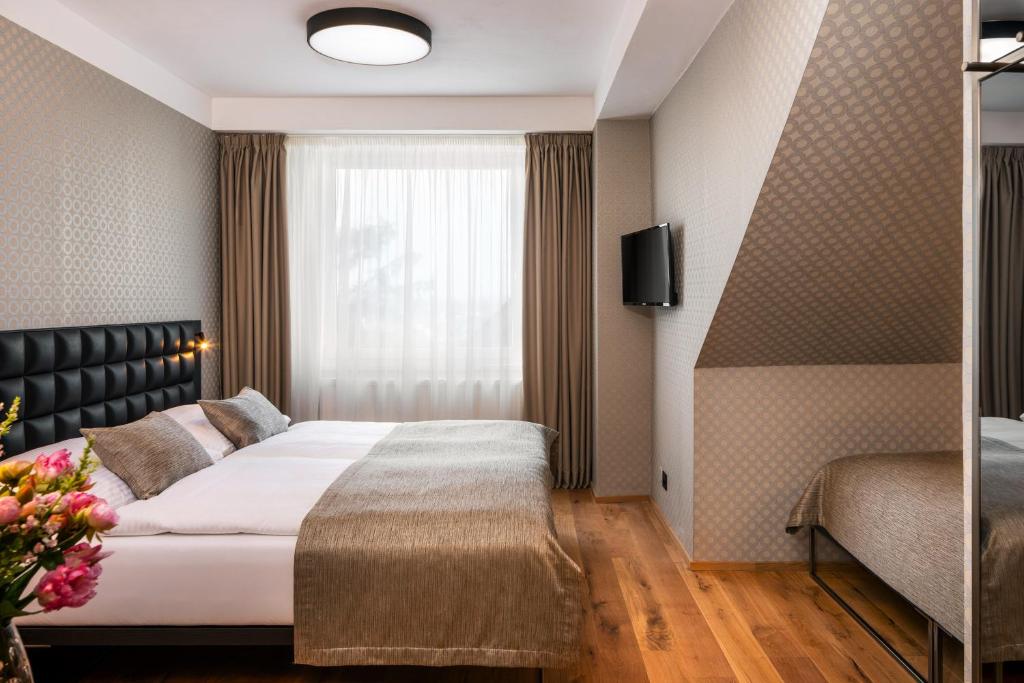 Postel nebo postele na pokoji v ubytování Hotel Aida