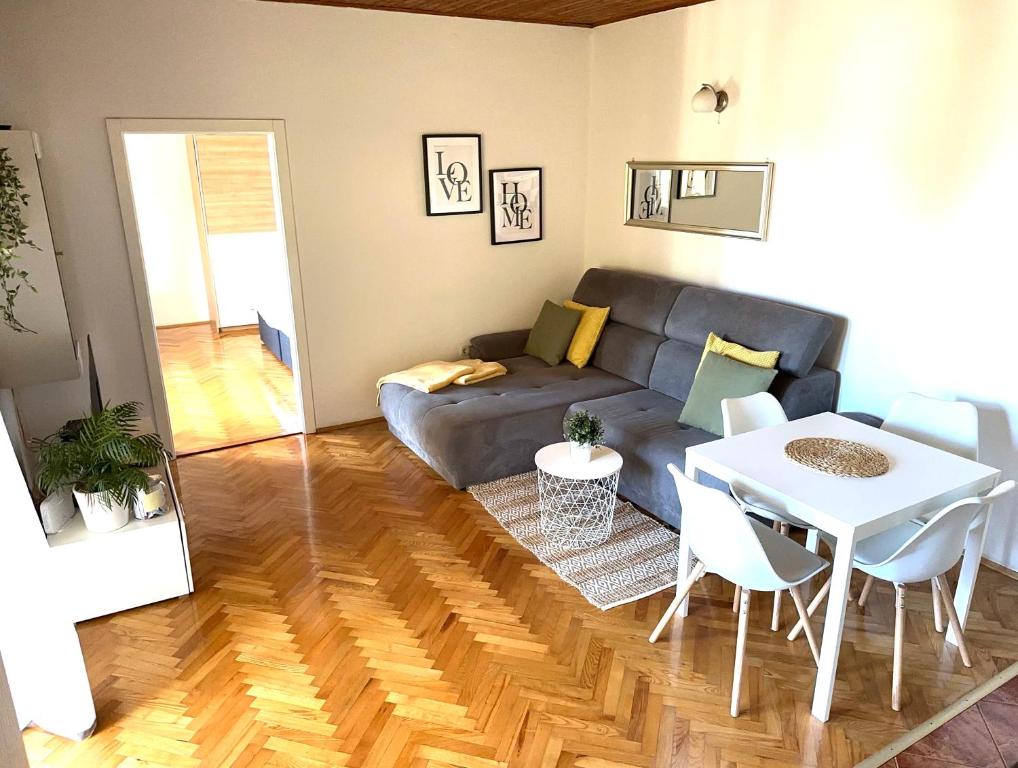 a living room with a couch and a table at Apartment Marino in Senj