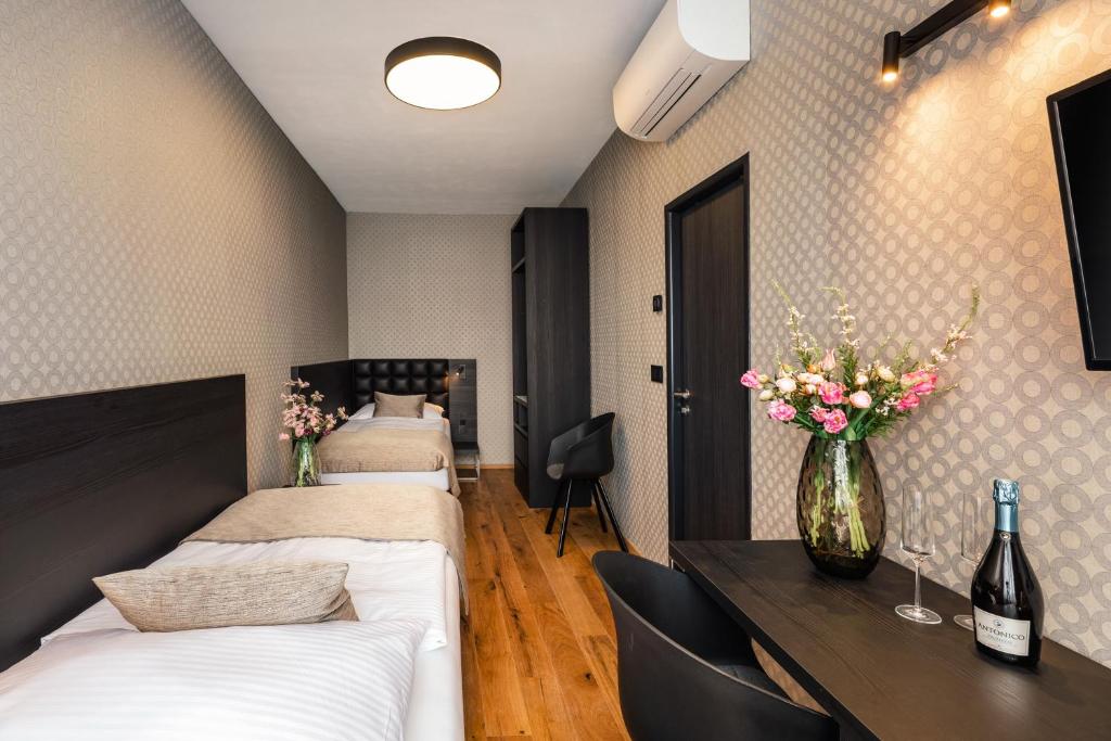 Postel nebo postele na pokoji v ubytování Hotel Aida