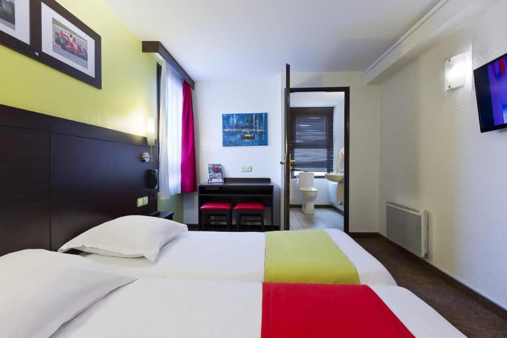 Postel nebo postele na pokoji v ubytování Enzo Hotels PONT-A-MOUSSON