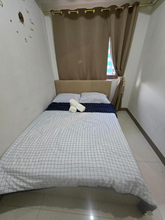 Postel nebo postele na pokoji v ubytování Sojourn in S Residences