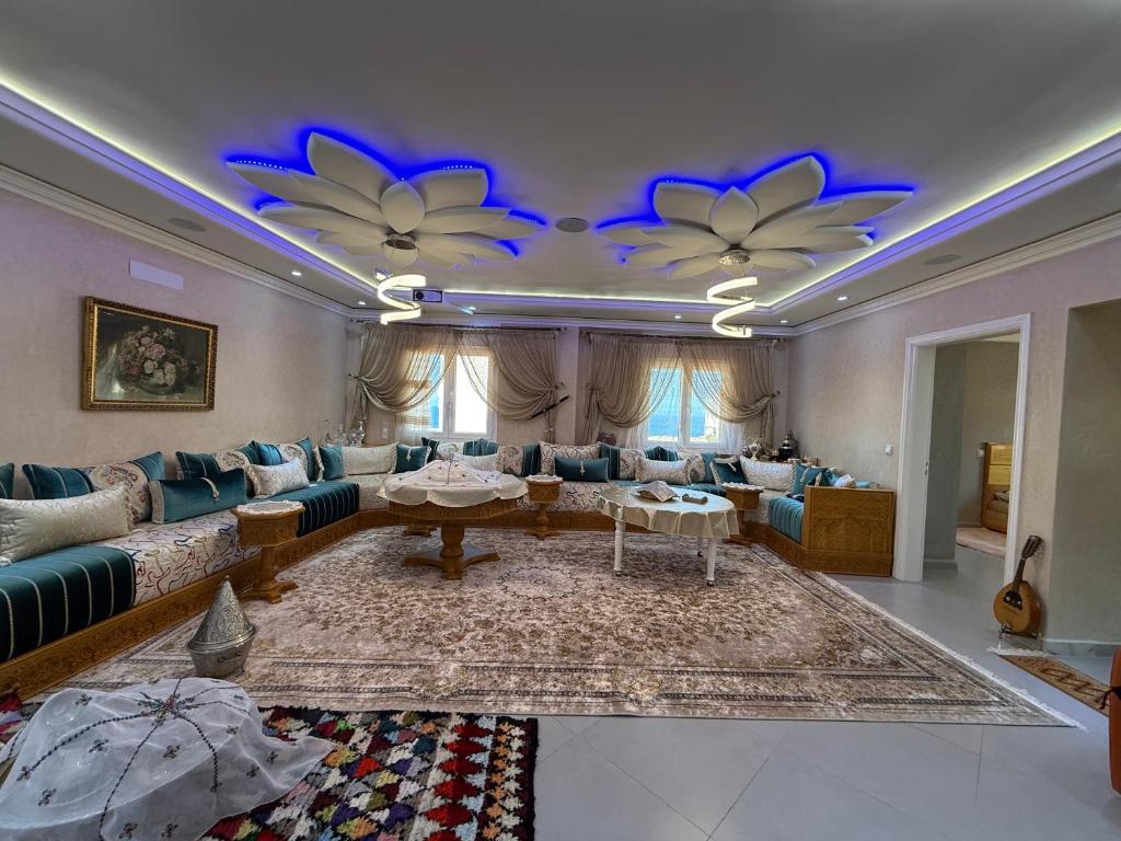 a living room with a couch and a table at Sea View Apartment in Mirleft