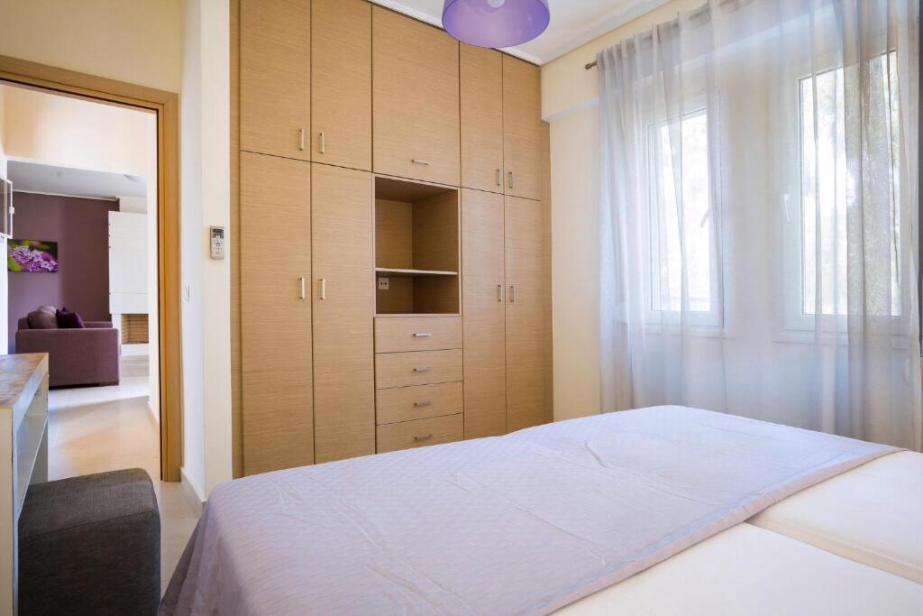 Łóżko lub łóżka w pokoju w obiekcie Deluxe Kefalonia Apartment Apartment Neroli 2 Bedroom Pool Karavomilos
