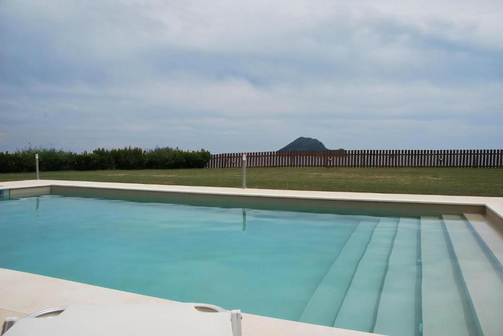 a large swimming pool with blue water at Luxury Zante Villa Zante Vista Villa Private Pool Seaviews Agios Sostis in Laganas