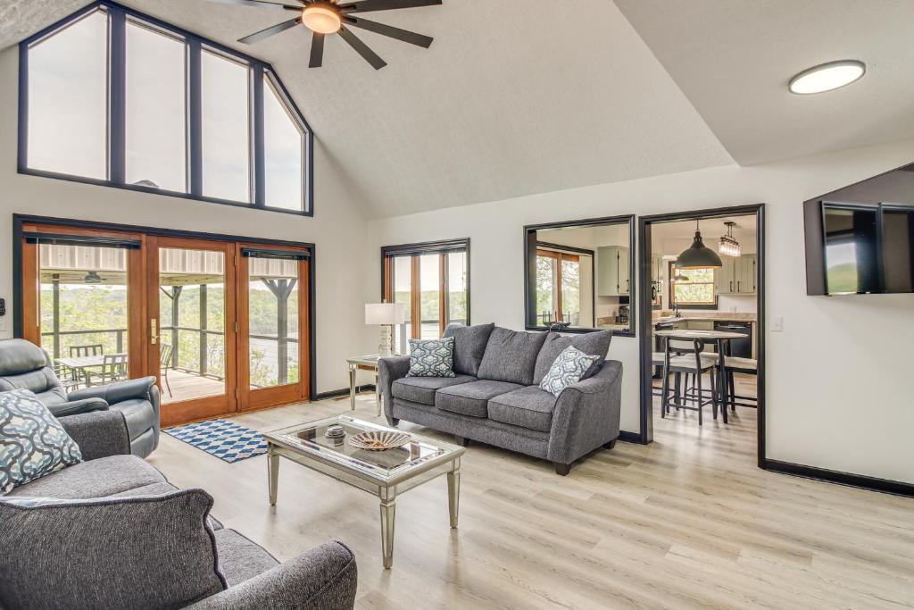 a living room with two couches and a table at Walk to Marina Water-View Dale Hollow Lake Escape in Celina