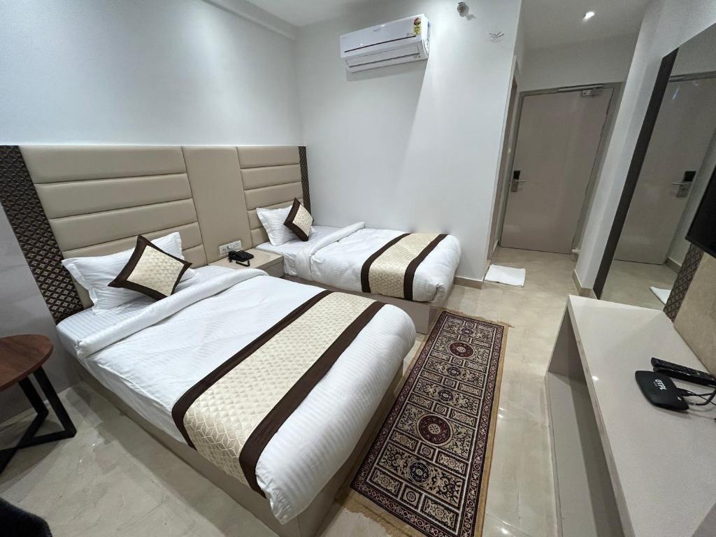 Postel nebo postele na pokoji v ubytování Hotel President