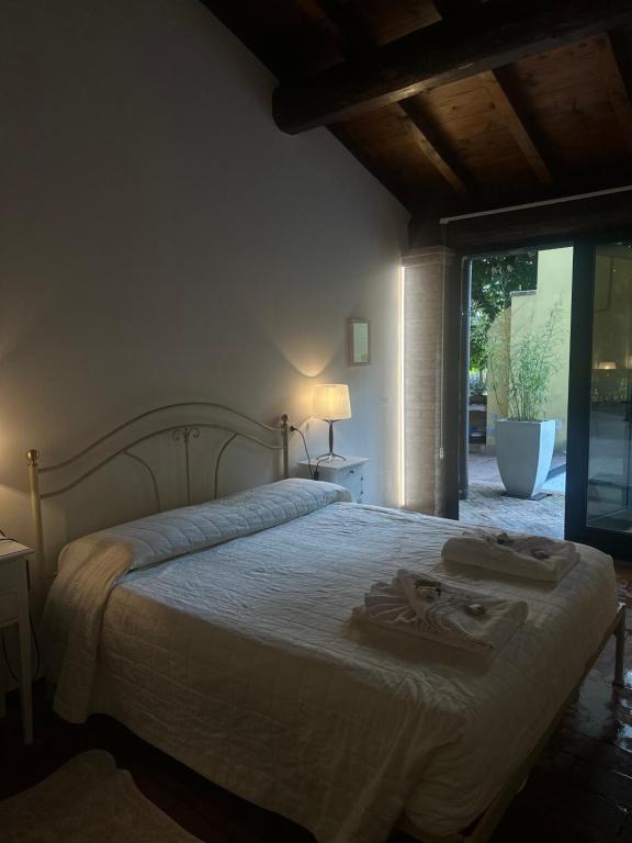 Postel nebo postele na pokoji v ubytování Agriturismo Corte Capiluppia
