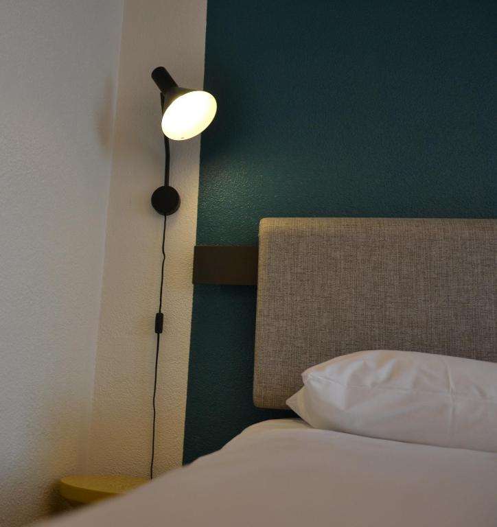 Postel nebo postele na pokoji v ubytování ibis Chambery