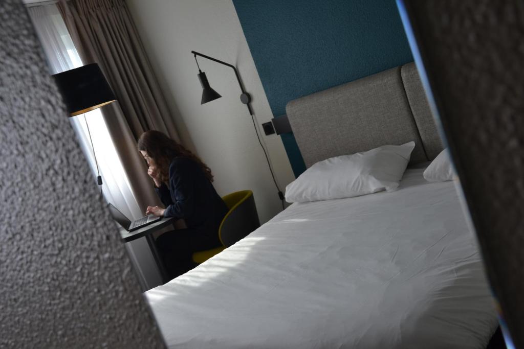 Postel nebo postele na pokoji v ubytování ibis Chambery