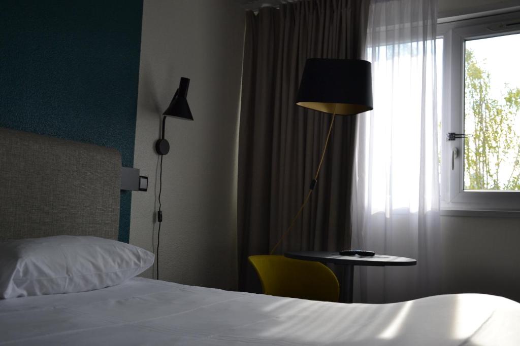 Postel nebo postele na pokoji v ubytování ibis Chambery