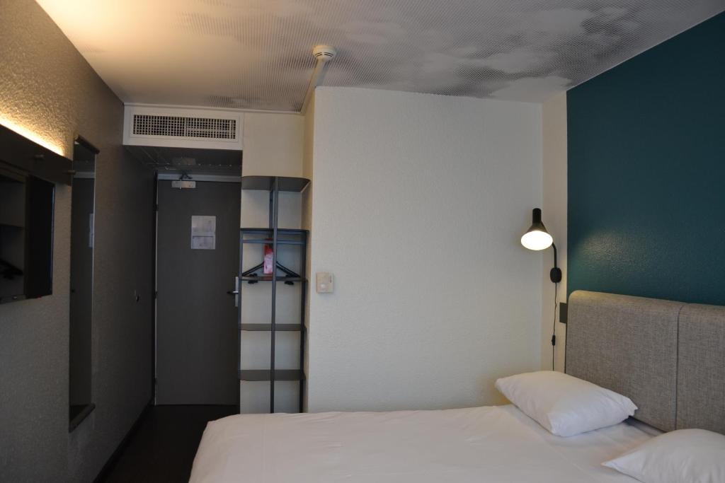 Postel nebo postele na pokoji v ubytování ibis Chambery