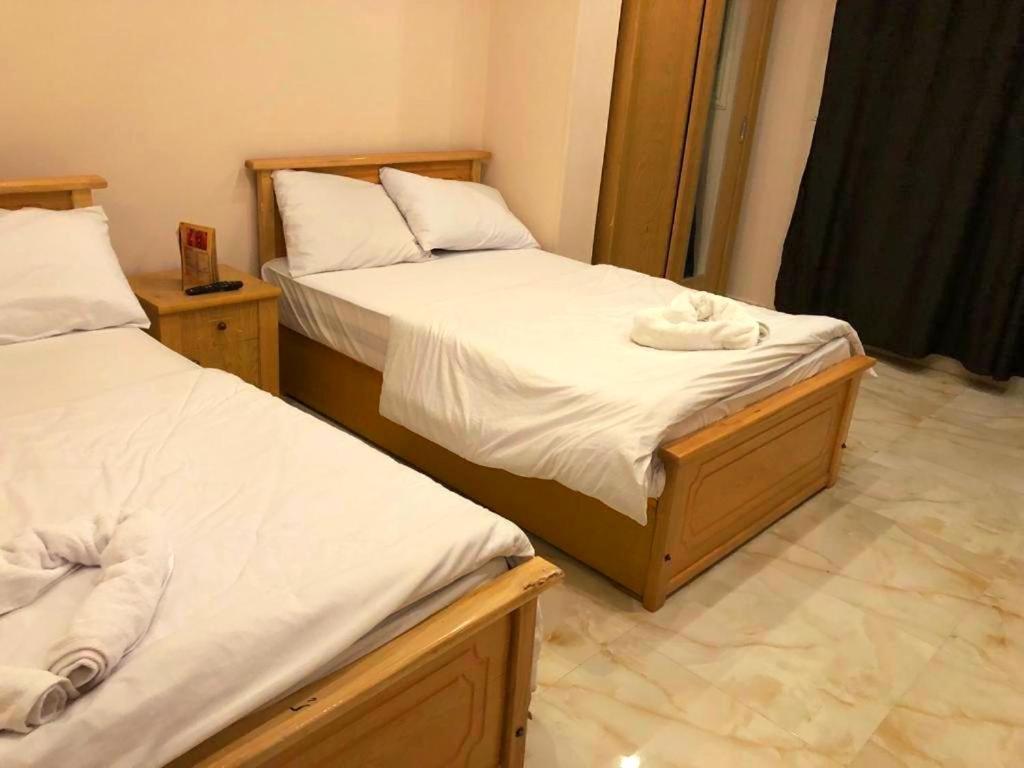 Postel nebo postele na pokoji v ubytování Grand Golden Pyramids View Hotel