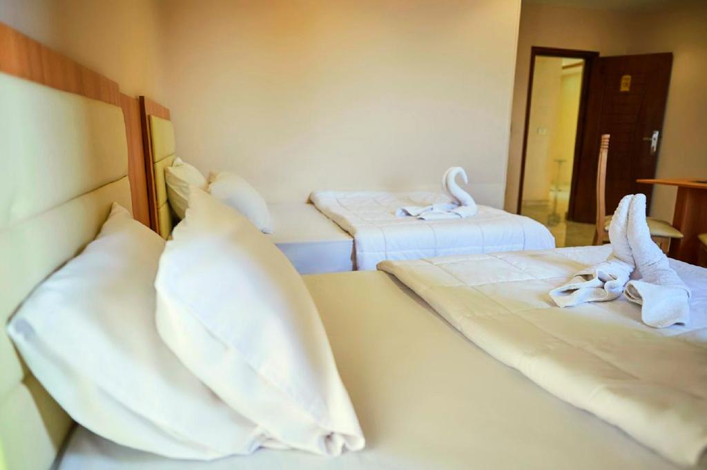 Postel nebo postele na pokoji v ubytování Grand Golden Pyramids View Hotel