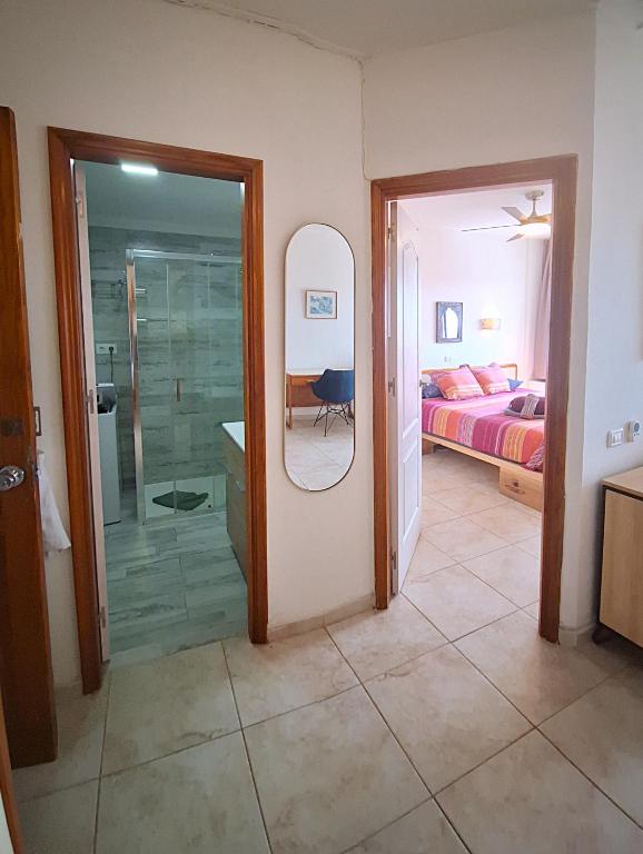 A bed or beds in a room at Casa Iguazu - At the center of Playa del Inglés
