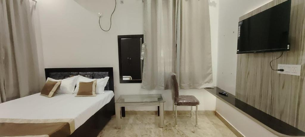 Postel nebo postele na pokoji v ubytování Hotel keptown