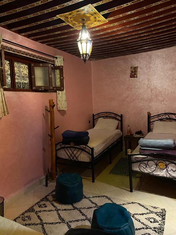 Postel nebo postele na pokoji v ubytování Downtown Hostel
