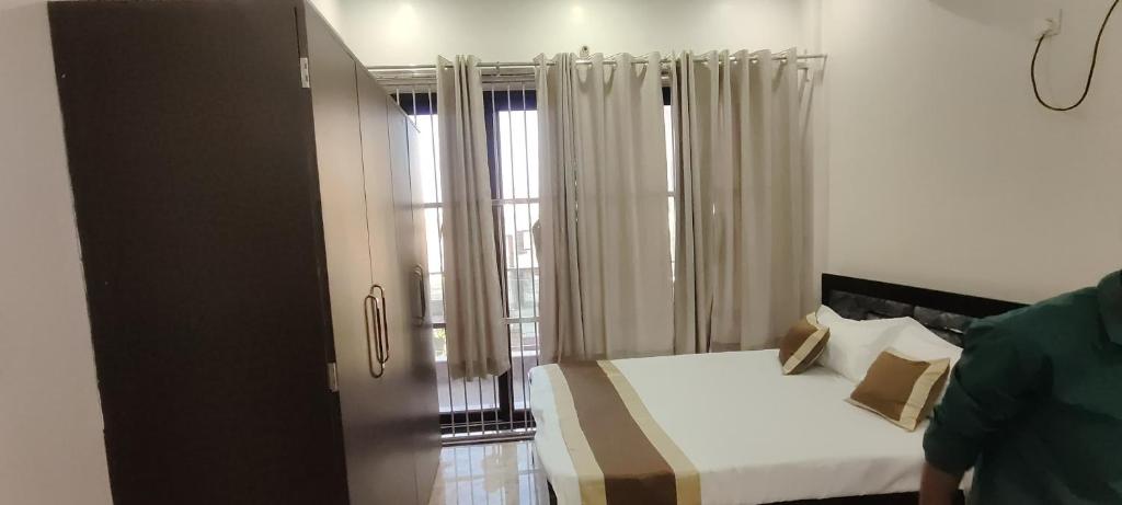 Postel nebo postele na pokoji v ubytování Hotel keptown