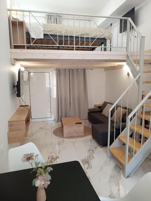 a living room with a loft bed and a couch at George and Helen's Studio in Corfu