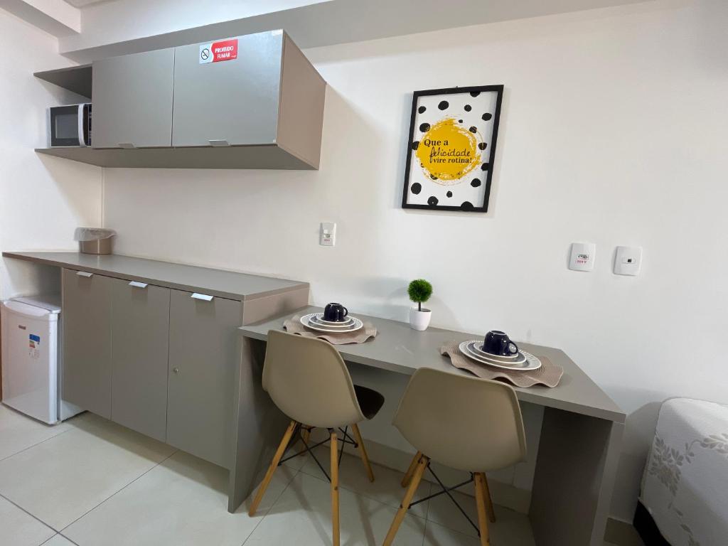 Kuchyň nebo kuchyňský kout v ubytování Manaíra Apart Hotel
