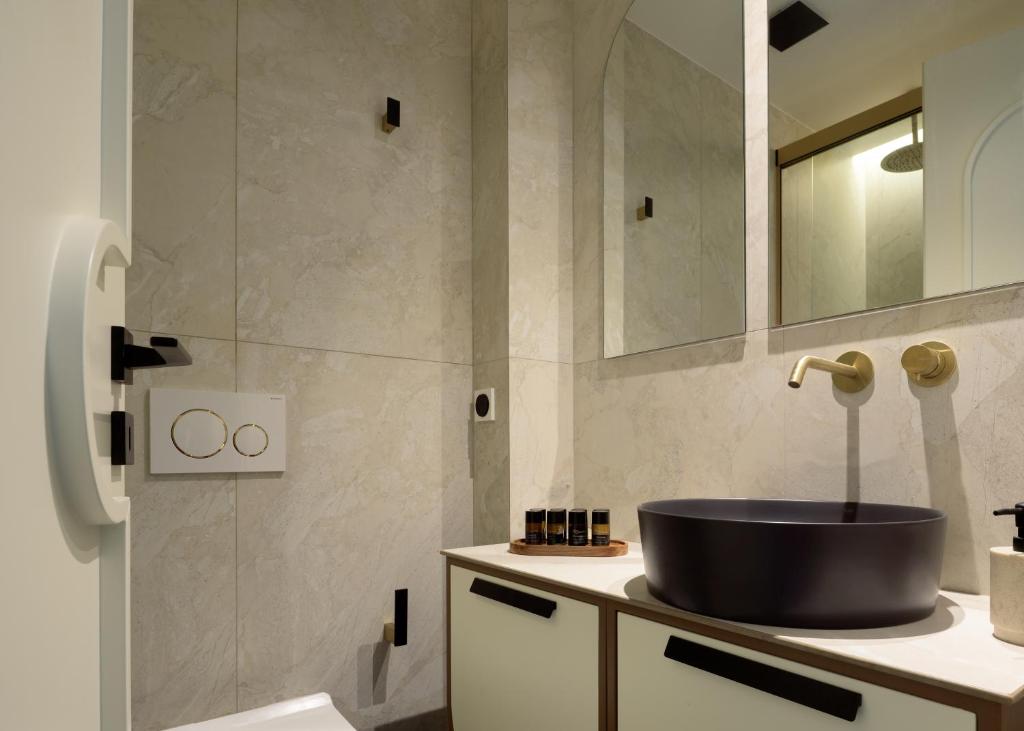 Koupelna v ubytování Allegro Suites