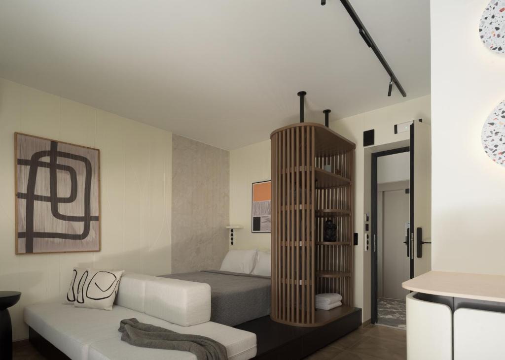 Postel nebo postele na pokoji v ubytování Allegro Suites