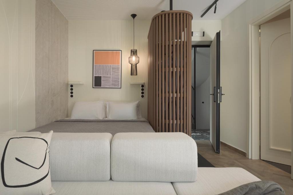 Postel nebo postele na pokoji v ubytování Allegro Suites