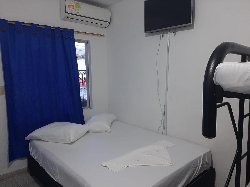Postel nebo postele na pokoji v ubytování Hotel Los Delfines Melgar