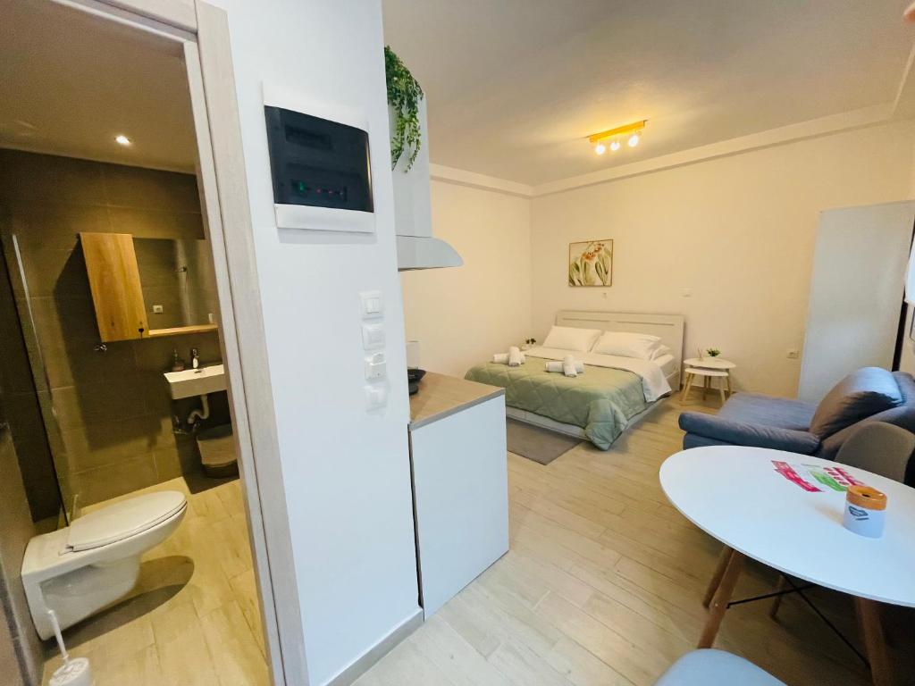 a room with a kitchen and a living room at Studio 87 in Rhodes Town