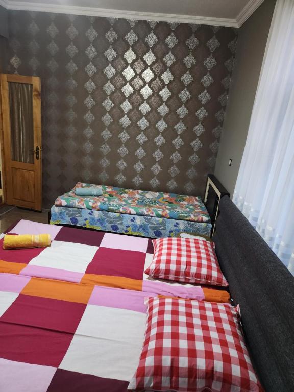Postel nebo postele na pokoji v ubytování Guesthouse Vashlovani