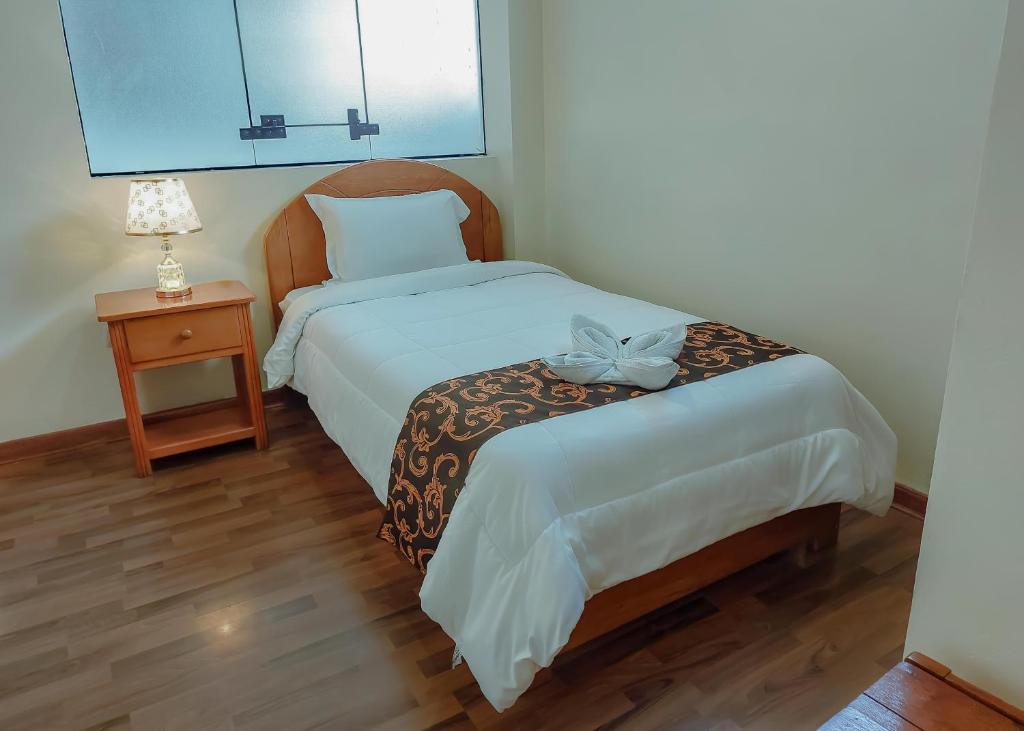 Postel nebo postele na pokoji v ubytování Hotel Casa Shami