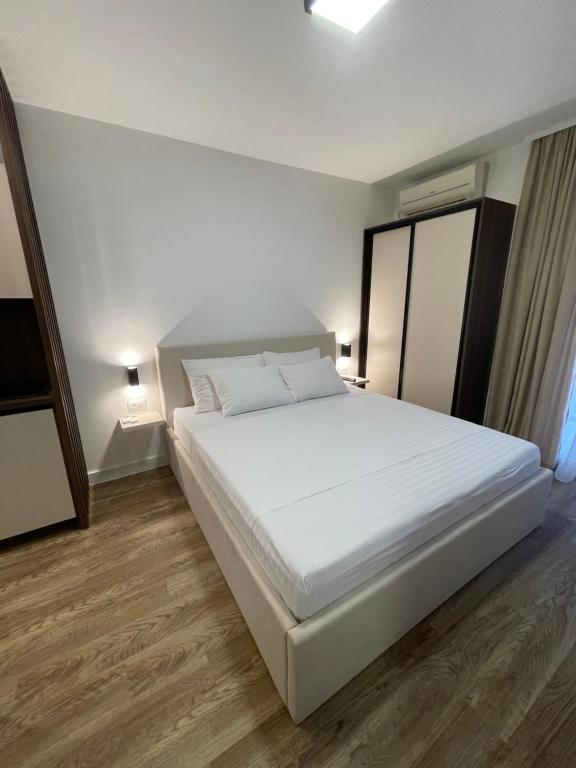 Postel nebo postele na pokoji v ubytování Apartments Njavro Neum