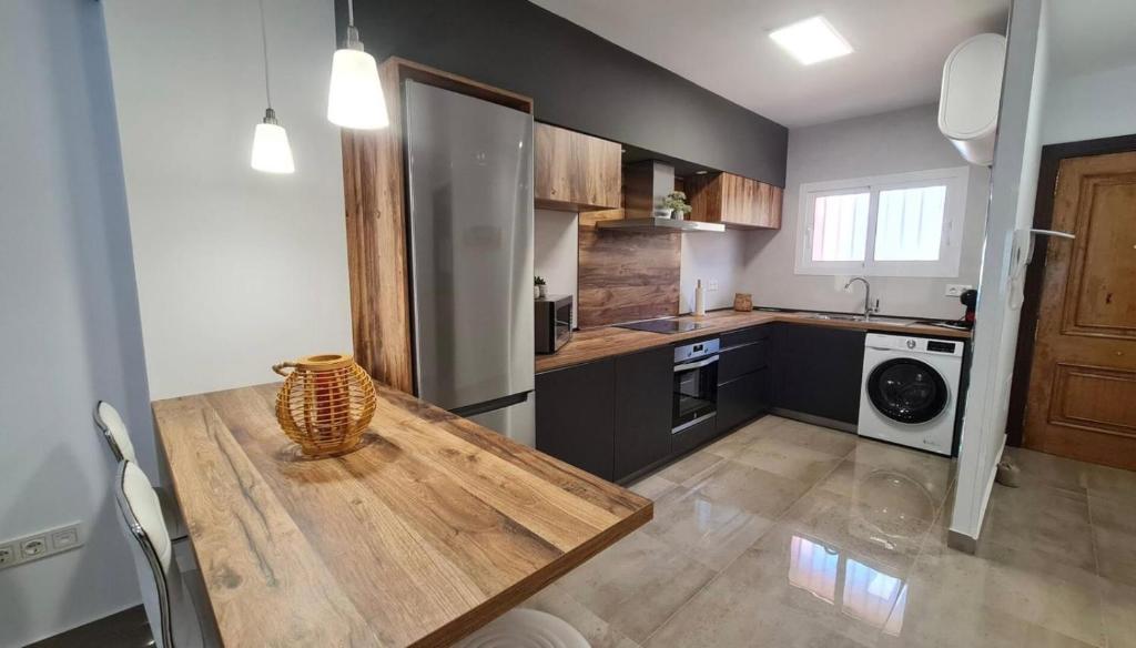 Kuchyň nebo kuchyňský kout v ubytování Apartamento con Piscina