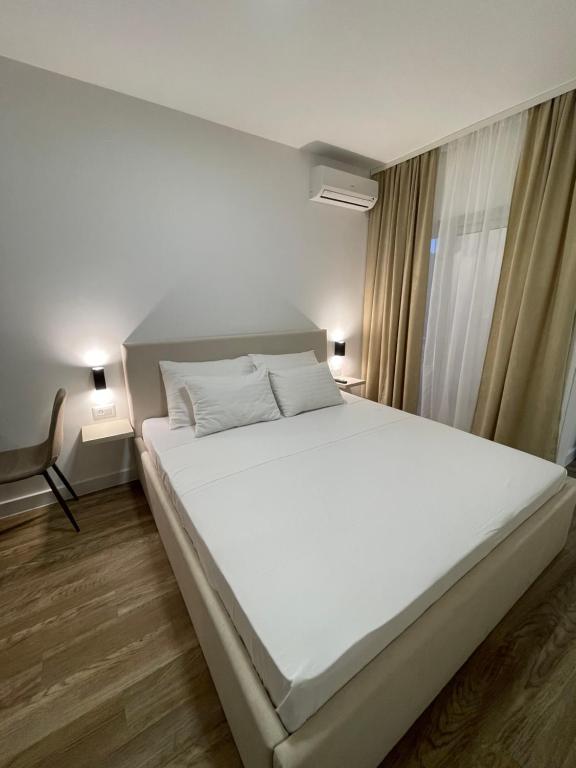 Postel nebo postele na pokoji v ubytování Apartments Njavro Neum