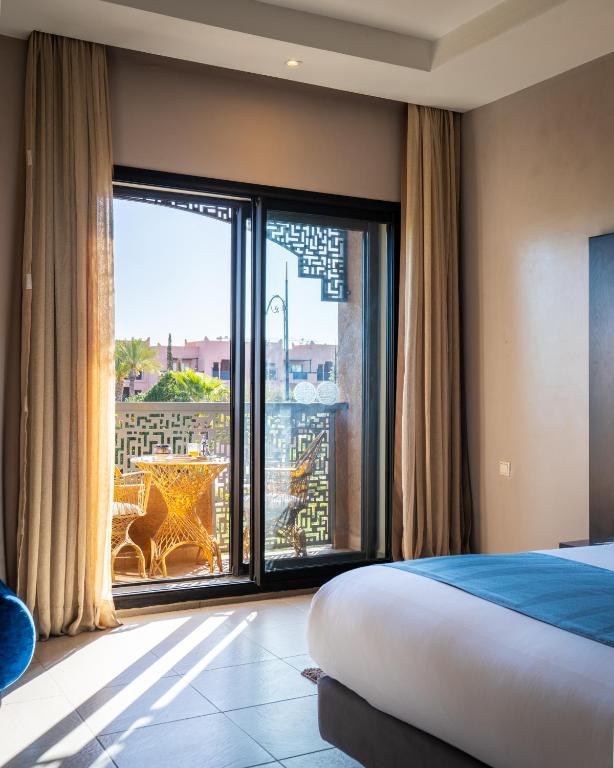 Postel nebo postele na pokoji v ubytování Kech Boutique Hotel & Spa