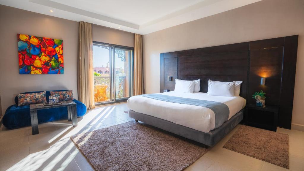 Postel nebo postele na pokoji v ubytování Kech Boutique Hotel & Spa