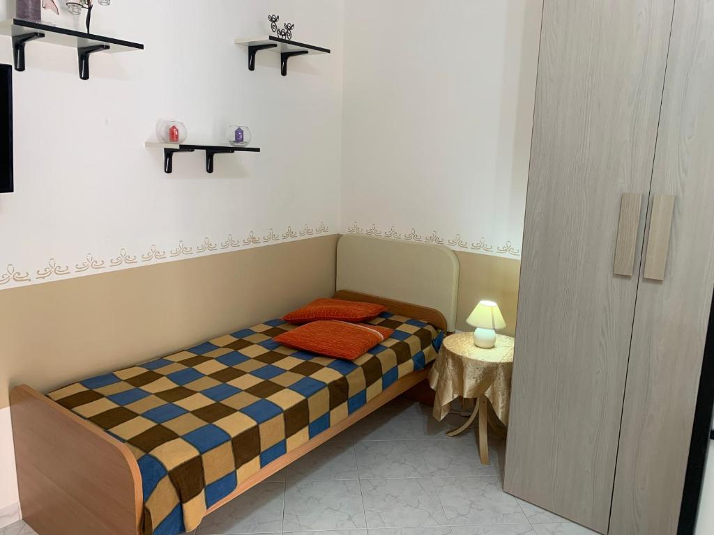 Łóżko lub łóżka w pokoju w obiekcie Casa Margherita