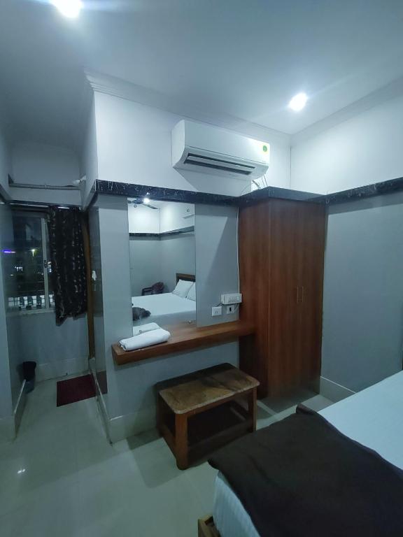 Postel nebo postele na pokoji v ubytování Hotel Govindh Heights
